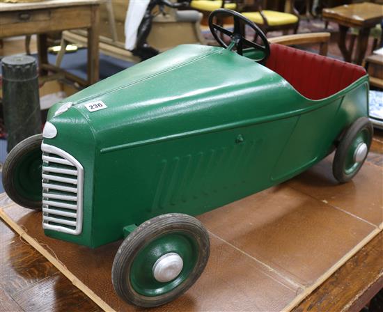 A childs pedal car